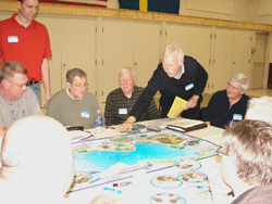 Local officials hear about tax boost from lake shore; also practice improving water quality by participating in 'The Watershed Game' 