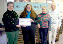 Quilters donate to The Refuge and others 