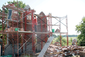 On the edge of a wildlife area, memorial garden fresco panels are taking shape