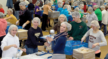 Hundreds pitch-in at 'Feed My Starving Children' mobile pack