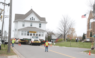 Smooth move for historic parsonage, as townsfolk look on