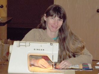 Hannah's Arms 'Graduate' earns sewing machine; you can too!