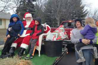 Santa collects gifts for Anonymous Santa and the Rotary