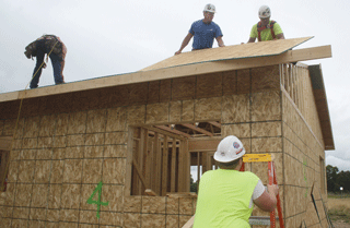 Habitat house gets walls, roof in recent days