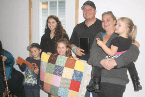 Habitat for Humanity presents keys for  'second chance' home