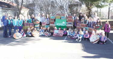 Local Girl Scouts donate over 1,000 boxes of cookies to troops