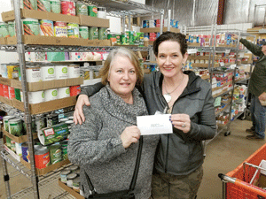 Food shelf re-stocking with  a little help from its friends