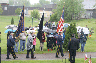 Veterans brave a cold and rainy Memorial Day to honor those who've been lost