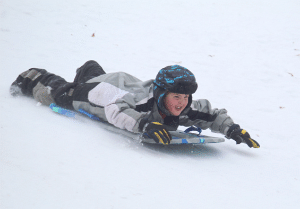 Local youth enjoy area sledding hills 