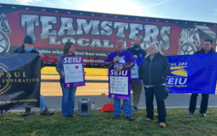 Custodial union rallies outside district office