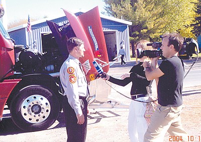 German TV production crew featuring Shafer and rolling memorial in upcoming report