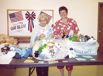 Quilt Club member helping others to last day 