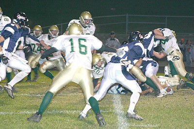 Wildcats push Cooper to the edge, Hawks hold on to win 28-20