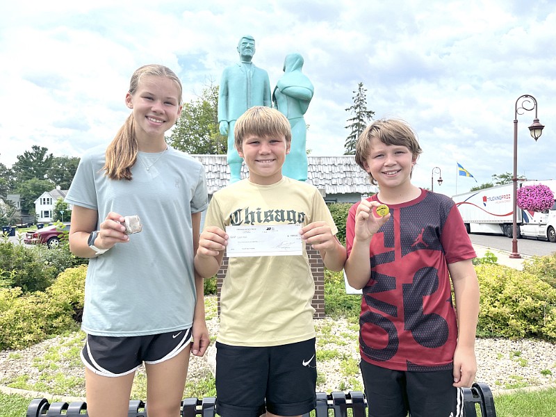 Finders of the missing Karl Oskar snuff box were Annika, Liam and Logan Hall.  The group found the box near a mailbox outside of Plastic Products.  The group took home a whopping $1,000 thanks in part to Carlson’s Amoco, Deutschland Meats,  City of Lindstrom and the Chisago County Press.  Good job and thanks to all who played.